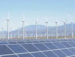 Panoramic view of a renewable energy landscape with wind turbines and solar panels in a green field, symbolizing sustainable energy solutions.